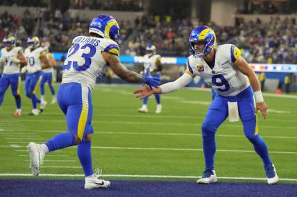 Los Angeles Rams running back Kyren Williams (23) celebrates with quarterback Matthew Stafford (9) in the fourth quarter against the Cleveland Browns SoFi Stadium. Mandatory Credit: Kirby Lee-USA TODAY Sports