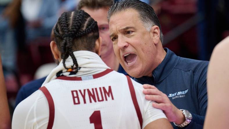 Dec 3, 2023; Stanford, California, USA; San Diego Toreros head coach Steve Lavin congratulates Stanford Cardinal guard Jared Bynum (1) after the game between the Stanford Cardinal and the San Diego Toreros at Maples Pavilion. Mandatory Credit: Robert Edwards-USA TODAY Sports