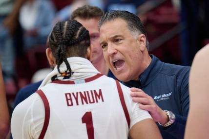 Dec 3, 2023; Stanford, California, USA; San Diego Toreros head coach Steve Lavin congratulates Stanford Cardinal guard Jared Bynum (1) after the game between the Stanford Cardinal and the San Diego Toreros at Maples Pavilion. Mandatory Credit: Robert Edwards-USA TODAY Sports
