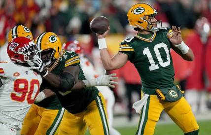 Green Bay Packers quarterback Jordan Love (10) throws a pass for a first down during the second quarter of their game against the Kansas City Chiefs Sunday, December 3, 2023 at Lambeau Field in Green Bay, Wisconsin.