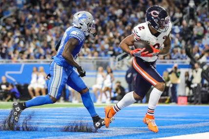 Chicago Bears wide receiver DJ Moore catches a touchdown pass against Detroit Lions cornerback Jerry Jacobs during the second half at Ford Field in Detroit on Sunday, Nov. 19, 2023.