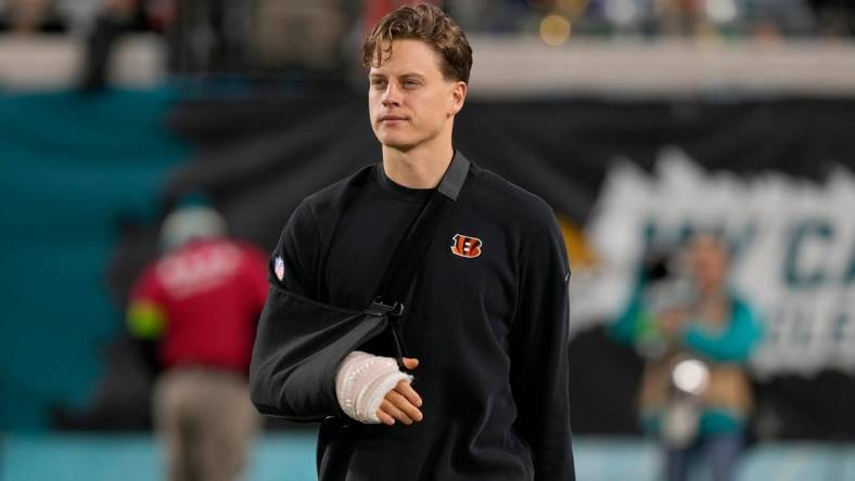 Cincinnati Bengals quarterback Joe Burrow takes the field to watch his team practice before facing the Jacksonville Jaguars at Everbank Stadium in Jacksonville, Florida Monday, December 4, 2023.