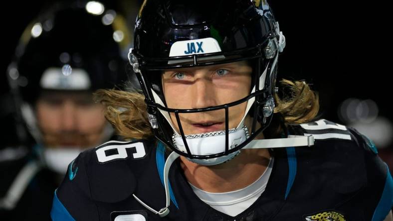 Jacksonville Jaguars quarterback Trevor Lawrence (16) leads his team onto the field before a regular season NFL football matchup Monday, Dec. 4, 2023 at EverBank Stadium in Jacksonville, Fla. The Cincinnati Bengals defeated the Jacksonville Jaguars 34-31 in overtime. [Corey Perrine/Florida Times-Union]