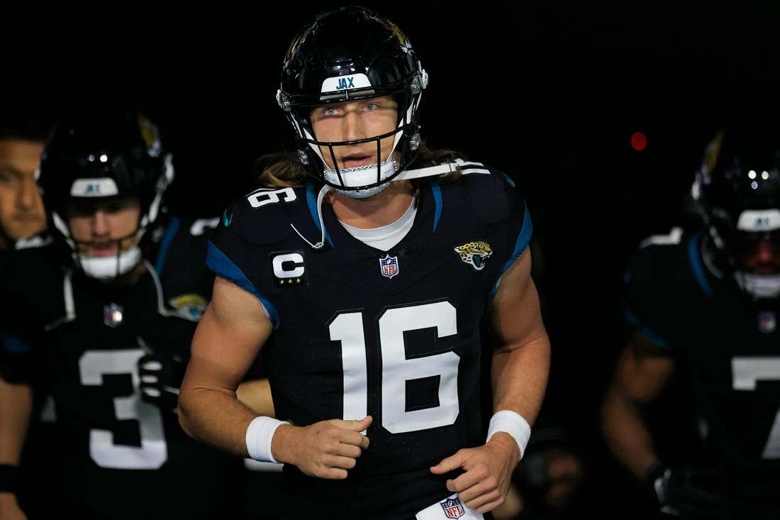 Jacksonville Jaguars quarterback Trevor Lawrence (16) leads his team onto the field before a regular season NFL football matchup Monday, Dec. 4, 2023 at EverBank Stadium in Jacksonville, Fla. The Cincinnati Bengals defeated the Jacksonville Jaguars 34-31 in overtime. [Corey Perrine/Florida Times-Union]