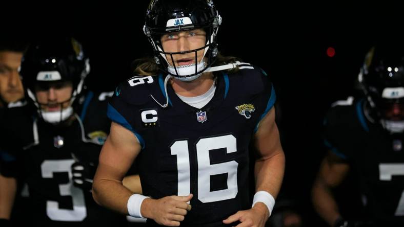 Jacksonville Jaguars quarterback Trevor Lawrence (16) leads his team onto the field before a regular season NFL football matchup Monday, Dec. 4, 2023 at EverBank Stadium in Jacksonville, Fla. The Cincinnati Bengals defeated the Jacksonville Jaguars 34-31 in overtime. [Corey Perrine/Florida Times-Union]