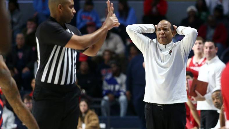 Nov 28, 2023; Oxford, Mississippi, USA; North Carolina State Wolfpack head coach Kevin Keatts (right) reacts to a foul call during the second half  against the Mississippi Rebels at The Sandy and John Black Pavilion at Ole Miss. Mandatory Credit: Petre Thomas-USA TODAY Sports