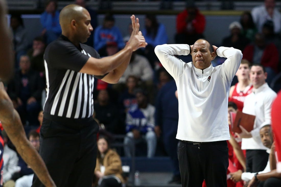 Nov 28, 2023; Oxford, Mississippi, USA; North Carolina State Wolfpack head coach Kevin Keatts (right) reacts to a foul call during the second half  against the Mississippi Rebels at The Sandy and John Black Pavilion at Ole Miss. Mandatory Credit: Petre Thomas-USA TODAY Sports