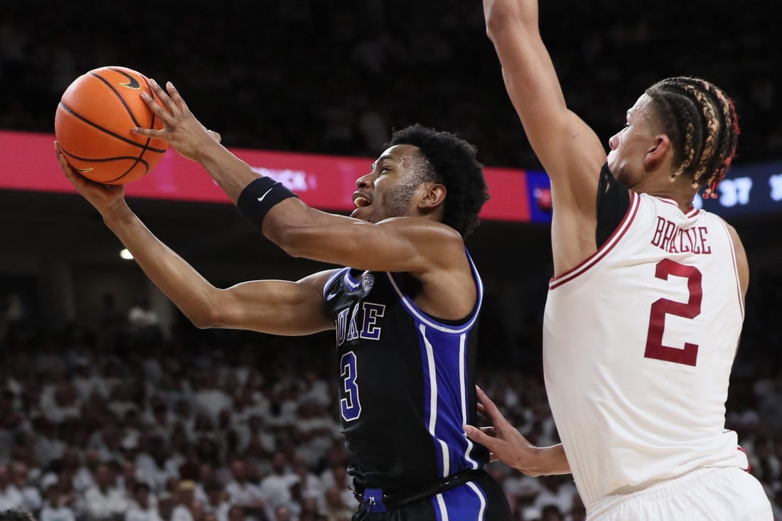 Nov 29, 2023; Fayetteville, Arkansas, USA; Duke Blue Devils guard Jeremy Roach (3) drives to the during the first half as Arkansas Razorbacks forward Trevon Brazile (2) defends at Bud Walton Arena. Arkansas won 80-75. Mandatory Credit: Nelson Chenault-USA TODAY Sports