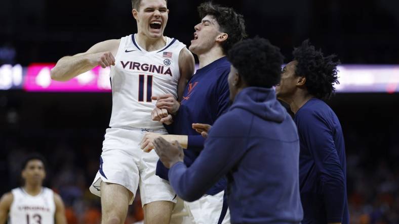 Dec 5, 2023; Charlottesville, Virginia, USA; Virginia Cavaliers guard Isaac McKneely (11) celebrates with teammates against the North Carolina Central Eagles in the first half at John Paul Jones Arena. Mandatory Credit: Geoff Burke-USA TODAY Sports