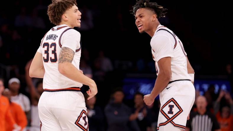 Illinois Fighting Illini forward Coleman Hawkins (33) celebrates his three point shot against the Florida Atlantic Owls with guard Terrence Shannon Jr. (0) during the second half at Madison Square Garden. Mandatory Credit: Brad Penner-USA TODAY Sports