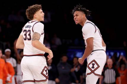 Illinois Fighting Illini forward Coleman Hawkins (33) celebrates his three point shot against the Florida Atlantic Owls with guard Terrence Shannon Jr. (0) during the second half at Madison Square Garden. Mandatory Credit: Brad Penner-USA TODAY Sports