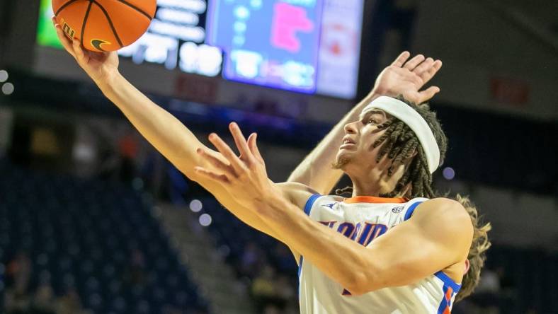 Florida Gators guard Walter Clayton Jr. (1) shoots during first half action of an NCAA basketball game as Florida Gators take on Merrimack College Warrors at Exactech Areana in Gainesville, FL on Tuesday, December 5, 2023. [Alan Youngblood/Gainesville Sun]