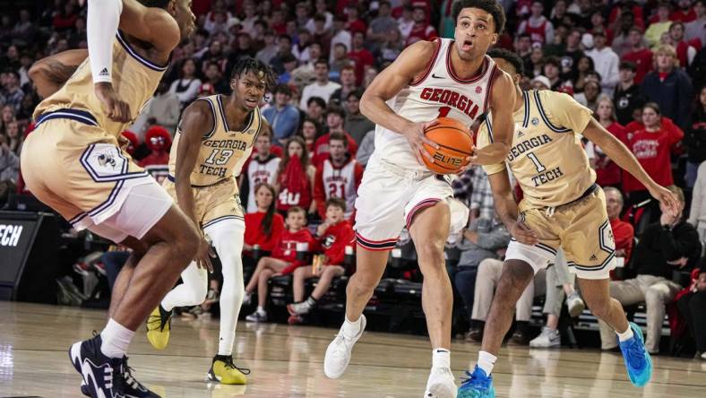 Dec 5, 2023; Athens, Georgia, USA; Georgia Bulldogs guard Jabri Abdur-Rahim (1) drives the ball to the basket against the Georgia Tech Yellow Jackets at Stegeman Coliseum. Mandatory Credit: Dale Zanine-USA TODAY Sports