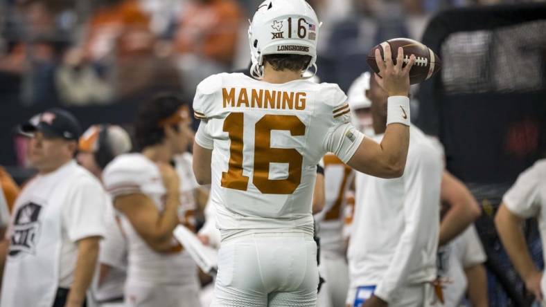 Dec 2, 2023; Arlington, TX, USA; Texas Longhorns quarterback Arch Manning (16) in action during the game between the Texas Longhorns and the Oklahoma State Cowboys at AT&T Stadium. Mandatory Credit: Jerome Miron-USA TODAY Sports