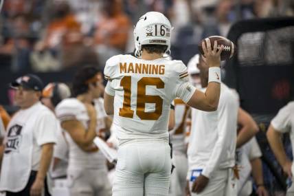 Dec 2, 2023; Arlington, TX, USA; Texas Longhorns quarterback Arch Manning (16) in action during the game between the Texas Longhorns and the Oklahoma State Cowboys at AT&T Stadium. Mandatory Credit: Jerome Miron-USA TODAY Sports