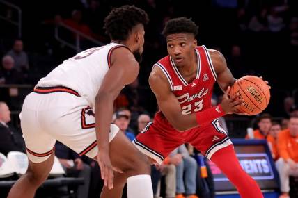 Dec 5, 2023; New York, New York, USA; Florida Atlantic Owls guard Brandon Weatherspoon (23) controls the ball against Illinois Fighting Illini forward Quincy Guerrier (13) during the second half at Madison Square Garden. Mandatory Credit: Brad Penner-USA TODAY Sports