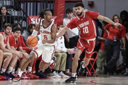 Dec 6, 2023; Queens, New York, USA; St. John's Red Storm guard Daniss Jenkins (5) drives past Sacred Heart Pioneers guard Kyle McGee (10) in the first half at Carnesecca Arena. Mandatory Credit: Wendell Cruz-USA TODAY Sports