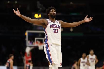 Dec 6, 2023; Washington, District of Columbia, USA; Philadelphia 76ers center Joel Embiid (21) celebrates after scoring his 50th point of the game against the Washington Wizards in the fourth quarter at Capital One Arena. Mandatory Credit: Geoff Burke-USA TODAY Sports
