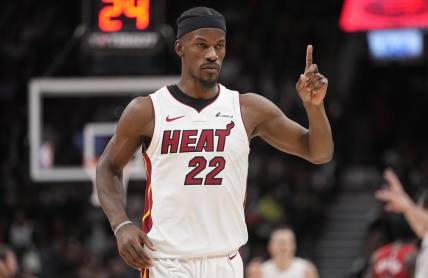 Dec 6, 2023; Toronto, Ontario, CAN; Miami Heat forward Jimmy Butler (22) gestures his bench during the fourth quarter against the Toronto Raptors at Scotiabank Arena. Mandatory Credit: John E. Sokolowski-USA TODAY Sports
