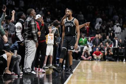 Dec 6, 2023; Atlanta, Georgia, USA; Brooklyn Nets forward Mikal Bridges (1) reacts with the fans after making the eventual game winning basket against the Atlanta Hawks in the final minute during the second half at State Farm Arena. Mandatory Credit: Dale Zanine-USA TODAY Sports
