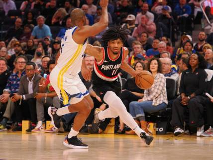 Dec 6, 2023; San Francisco, California, USA; Portland Trail Blazers guard Shaedon Sharpe (17) drives in against Golden State Warriors guard Chris Paul (3) during the second quarter at Chase Center. Mandatory Credit: Kelley L Cox-USA TODAY Sports