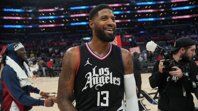 Dec 6, 2023; Los Angeles, California, USA; LA Clippers forward Paul George (13) reacts after the game against the Denver Nuggets at Crypto.com Arena. Mandatory Credit: Kirby Lee-USA TODAY Sports