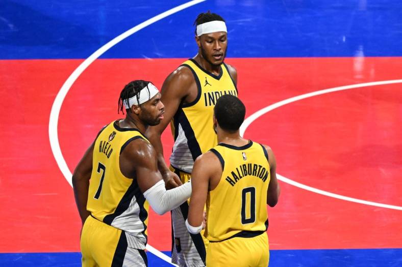 Dec 7, 2023; Las Vegas, Nevada, USA; Indiana Pacers guard Buddy Hield (7), center Myles Turner (33) and guard Tyrese Haliburton (0) celebrate after a victory against the Milwaukee Bucks at T-Mobile Arena. Mandatory Credit: Candice Ward-USA TODAY Sports
