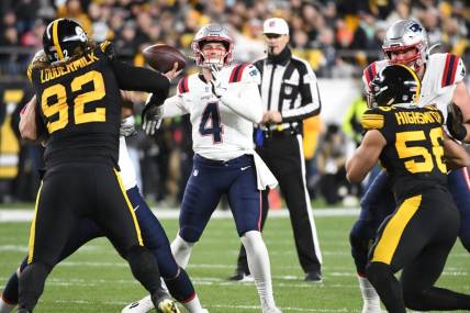 Dec 7, 2023; Pittsburgh, Pennsylvania, USA; New England Patriots quarterback Bailey Zappe (4) looks for a receiver against the Pittsburgh Steelers during the first quarter at Acrisure Stadium. Mandatory Credit: Philip G. Pavely-USA TODAY Sports