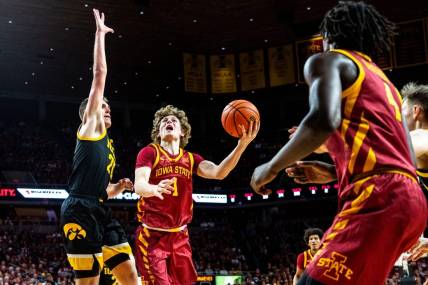 Iowa State's Jackson Paveletzke attempts a shot against Iowa's Payton Sandfort during a basketball game at Hilton Coliseum on Thursday, Dec. 7, 2023, in Ames.