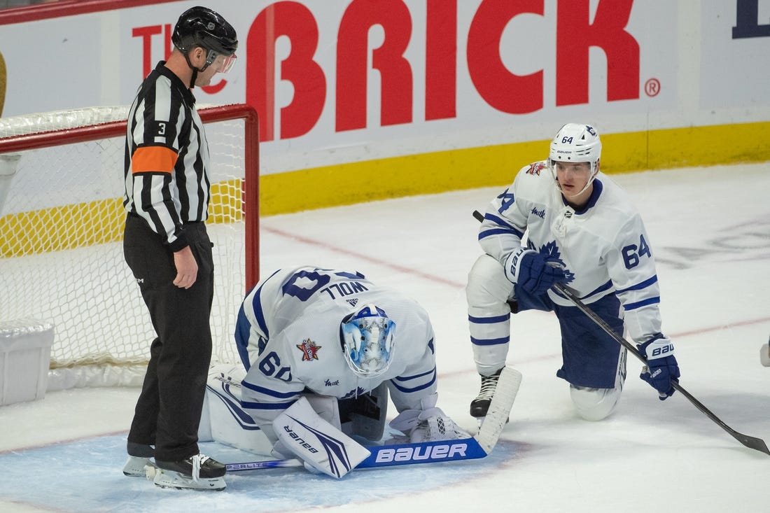 Dec 7, 2023; Ottawa, Ontario, CAN; Toronto Maple Leafs goalie Joseph Woll (60) is injured on a play in the third period against the  Ottawa Senators at the Canadian Tire Centre. Mandatory Credit: Marc DesRosiers-USA TODAY Sports