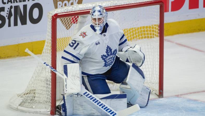 Dec 7, 2023; Ottawa, Ontario, CAN; Toronto Maple Leafs goalie Martin Jones (31) is called into action following an injury with Joseph Woll (60) in the third period against the Ottawa Senators at the Canadian Tire Centre. Mandatory Credit: Marc DesRosiers-USA TODAY Sports