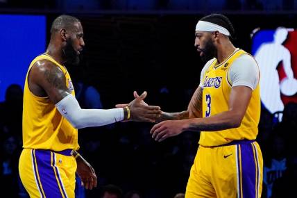 Dec 7, 2023; Las Vegas, Nevada, USA; Los Angeles Lakers forward LeBron James (23) celebrates with forward Anthony Davis (3) during the third quarter against the New Orleans Pelicans in the NBA In Season Tournament Semifinal at T-Mobile Arena. Mandatory Credit: Kyle Terada-USA TODAY Sports