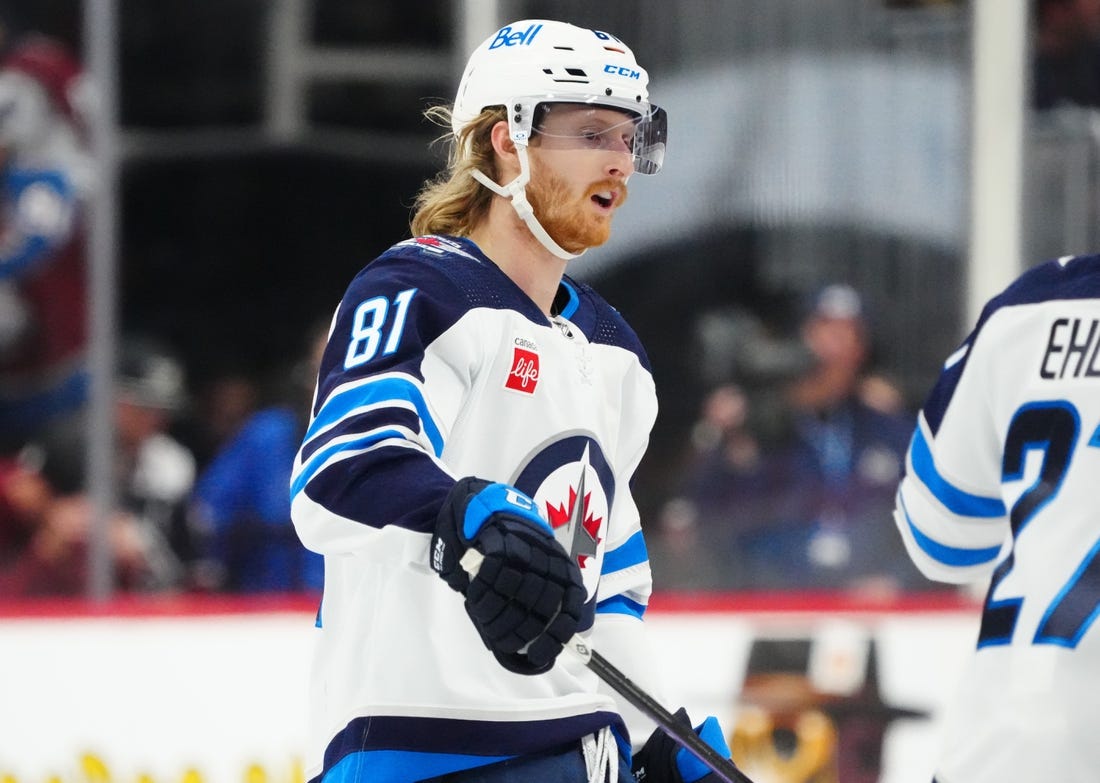 Dec 7, 2023; Denver, Colorado, USA; Winnipeg Jets left wing Kyle Connor (81) celebrates his goal in the third period against the Colorado Avalanche at Ball Arena. Mandatory Credit: Ron Chenoy-USA TODAY Sports