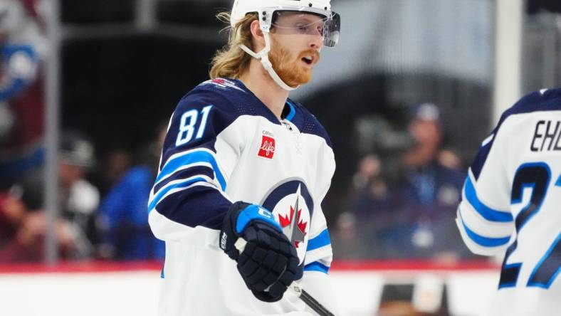 Dec 7, 2023; Denver, Colorado, USA; Winnipeg Jets left wing Kyle Connor (81) celebrates his goal in the third period against the Colorado Avalanche at Ball Arena. Mandatory Credit: Ron Chenoy-USA TODAY Sports