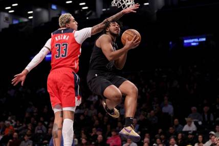 Dec 8, 2023; Brooklyn, New York, USA; Brooklyn Nets guard Cam Thomas (24) drives to the basket against Washington Wizards forward Kyle Kuzma (33) during the first quarter at Barclays Center. Mandatory Credit: Brad Penner-USA TODAY Sports