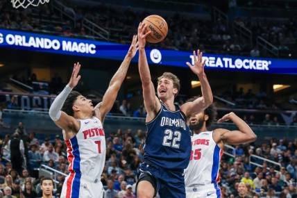 Dec 8, 2023; Orlando, Florida, USA; Orlando Magic forward Franz Wagner (22) goes to the basket against Detroit Pistons guard Killian Hayes (7) during the second quarter at Amway Center. Mandatory Credit: Mike Watters-USA TODAY Sports
