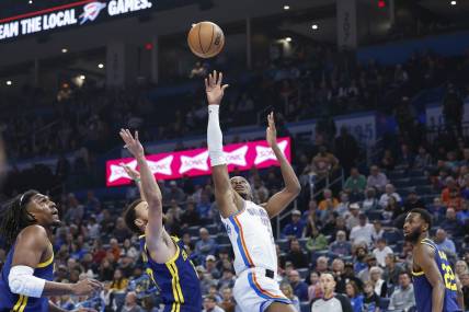 Dec 8, 2023; Oklahoma City, Oklahoma, USA; Oklahoma City Thunder guard Shai Gilgeous-Alexander (2) shoots against Golden State Warriors guard Stephen Curry (30) during the first quarter at Paycom Center. Mandatory Credit: Alonzo Adams-USA TODAY Sports