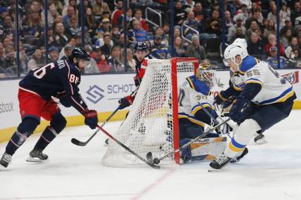 Dec 8, 2023; Columbus, Ohio, USA; St. Louis Blues defenseman Colton Parayko (55) stops the wraparound shot from Columbus Blue Jackets right wing Kirill Marchenko (86) during the second period at Nationwide Arena. Mandatory Credit: Russell LaBounty-USA TODAY Sports