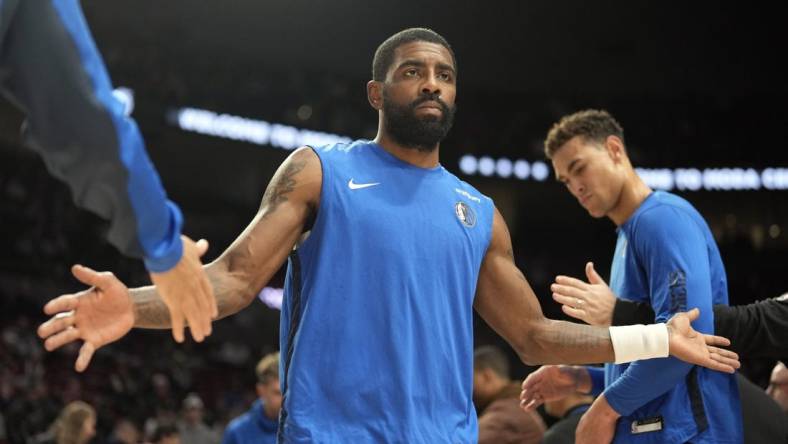 Dec 8, 2023; Portland, Oregon, USA; Dallas Mavericks point guard Kyrie Irving (11) is introduced as part of the starting lineup before the game against the Portland Trail Blazers at Moda Center. Mandatory Credit: Soobum Im-USA TODAY Sports