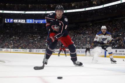 Dec 8, 2023; Columbus, Ohio, USA; Columbus Blue Jackets defenseman Zach Werenski (8) tracks down a loose puck against the St. Louis Blues during the first period at Nationwide Arena. Mandatory Credit: Russell LaBounty-USA TODAY Sports