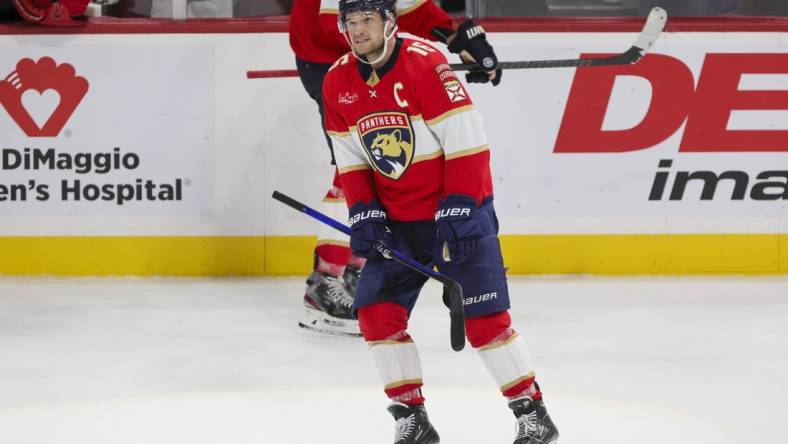 Dec 8, 2023; Sunrise, Florida, USA; Florida Panthers center Aleksander Barkov (16) looks on after scoring on an empty net against the Pittsburgh Penguins during the third period at Amerant Bank Arena. Mandatory Credit: Sam Navarro-USA TODAY Sports