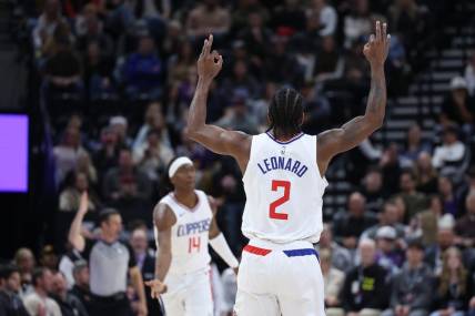 Dec 8, 2023; Salt Lake City, Utah, USA; Los Angeles Clippers forward Kawhi Leonard (2) reads to a three point shot against the Utah Jazz during the second quarter at Delta Center. Mandatory Credit: Rob Gray-USA TODAY Sports