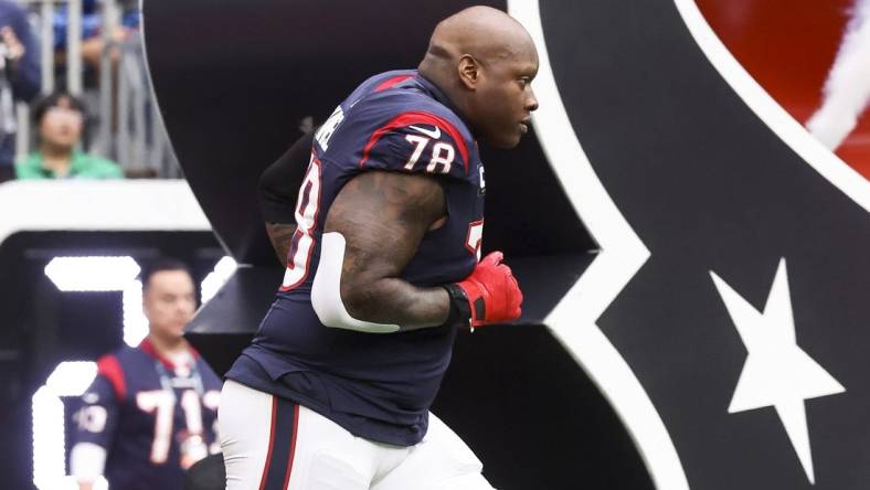 Dec 3, 2023; Houston, Texas, USA; Houston Texans offensive tackle Laremy Tunsil (78) runs onto the field before the game against the Denver Broncos at NRG Stadium. Mandatory Credit: Troy Taormina-USA TODAY Sports