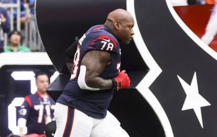 Dec 3, 2023; Houston, Texas, USA; Houston Texans offensive tackle Laremy Tunsil (78) runs onto the field before the game against the Denver Broncos at NRG Stadium. Mandatory Credit: Troy Taormina-USA TODAY Sports