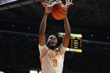 Dec 9, 2023; Knoxville, Tennessee, USA; Tennessee Volunteers forward Jonas Aidoo (0) dunks the ball against the Illinois Fighting Illini during the first half at Food City Center at Thompson-Boling Arena. Mandatory Credit: Randy Sartin-USA TODAY Sports