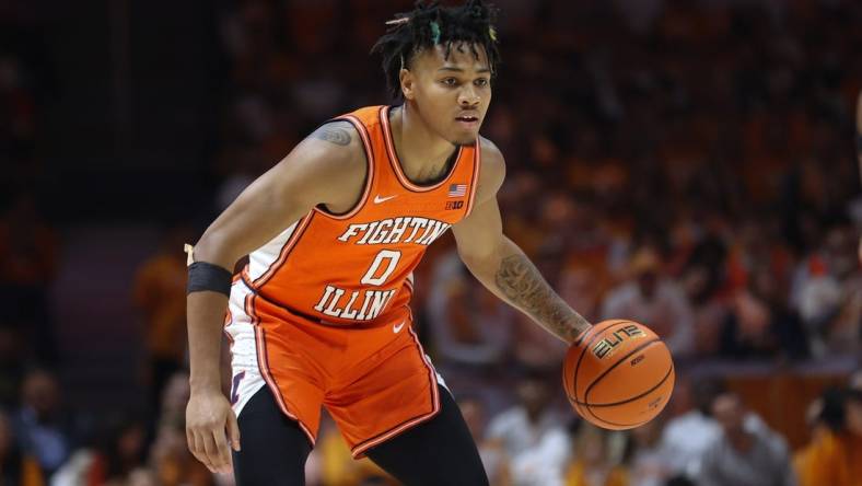 Dec 9, 2023; Knoxville, Tennessee, USA; Illinois Fighting Illini guard Terrence Shannon Jr. (0) brings the ball up court against the Tennessee Volunteers during the first half at Food City Center at Thompson Boling Arena. Mandatory Credit: Randy Sartin-USA TODAY Sports