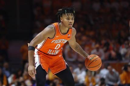Dec 9, 2023; Knoxville, Tennessee, USA; Illinois Fighting Illini guard Terrence Shannon Jr. (0) brings the ball up court against the Tennessee Volunteers during the first half at Food City Center at Thompson Boling Arena. Mandatory Credit: Randy Sartin-USA TODAY Sports