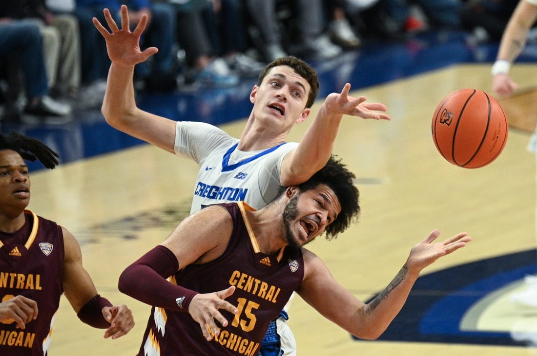 Dec 9, 2023; Omaha, Nebraska, USA;  Creighton Bluejays center Ryan Kalkbrenner (11) fouls Central Michigan Chippewas forward Markus Harding (15) on a rebound attempt in the first half at CHI Health Center Omaha. Mandatory Credit: Steven Branscombe-USA TODAY Sports