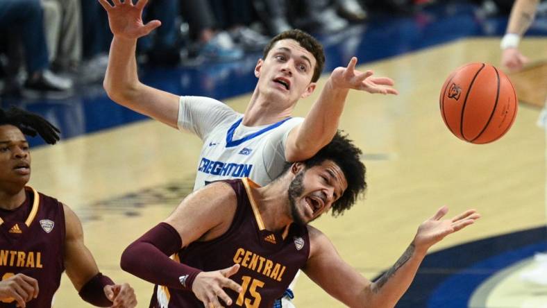 Dec 9, 2023; Omaha, Nebraska, USA;  Creighton Bluejays center Ryan Kalkbrenner (11) fouls Central Michigan Chippewas forward Markus Harding (15) on a rebound attempt in the first half at CHI Health Center Omaha. Mandatory Credit: Steven Branscombe-USA TODAY Sports