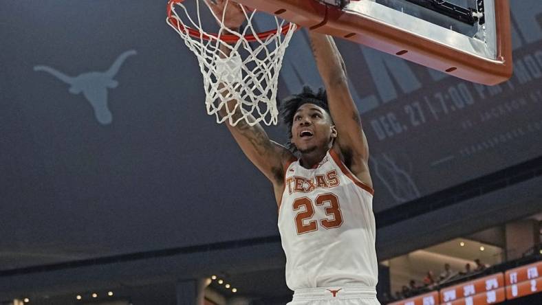 Dec 9, 2023; Austin, Texas, USA; Texas Longhorns forward Dillon Mitchell (23) dunks during the first half against the Houston Christian Huskies at Moody Center. Mandatory Credit: Scott Wachter-USA TODAY Sports